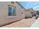 Paver driveway leading to the home's garage and a gated side entrance at 716 Cadence View Way, Henderson, NV 89011