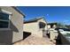 Exterior shot of the home featuring a garage, stucco walls, a tile roof, and a gated courtyard at 716 Cadence View Way, Henderson, NV 89011