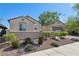 Attractive single-story house with desert landscaping, a low wall, and a two-car garage at 716 Cadence View Way, Henderson, NV 89011