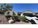 The home's exterior includes a tile roof, desert landscaping, and a paved driveway at 716 Cadence View Way, Henderson, NV 89011