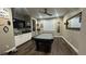 Spacious game room features a pool table, ceiling fan, and modern finishes at 716 Cadence View Way, Henderson, NV 89011