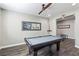 Game room with pool table, ceiling fan, and hardwood floors at 716 Cadence View Way, Henderson, NV 89011