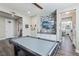 Game room with pool table, hardwood floors, and wall-mounted television at 716 Cadence View Way, Henderson, NV 89011