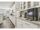 Bright kitchen featuring white cabinetry, subway tile backsplash, and stainless steel appliances at 716 Cadence View Way, Henderson, NV 89011