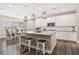 Open kitchen with a large island, pendant lights, stainless appliances, and bar stool seating at 716 Cadence View Way, Henderson, NV 89011