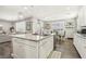 Bright and spacious kitchen featuring an island, pendant lighting, modern stainless steel appliances, and a dining area at 716 Cadence View Way, Henderson, NV 89011