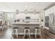 Bright, open kitchen featuring an island with stool seating, stainless appliances, and ample storage space at 716 Cadence View Way, Henderson, NV 89011
