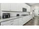 Modern kitchen featuring white cabinets, stainless steel appliances, and granite countertops with plenty of counter space at 716 Cadence View Way, Henderson, NV 89011