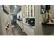 Modern kitchen boasts white cabinets, granite countertops, and stainless steel appliances at 716 Cadence View Way, Henderson, NV 89011