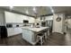 Open kitchen with large island, stainless steel appliances, and ample cabinet space at 716 Cadence View Way, Henderson, NV 89011