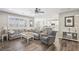 Spacious living room with hardwood floors, plantation shutters, and abundant natural light at 716 Cadence View Way, Henderson, NV 89011
