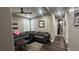 Cozy living room with comfortable seating, wood-look floors, and stylish decor at 716 Cadence View Way, Henderson, NV 89011