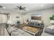 Inviting living room boasts a comfortable sofa, entertainment center, and a ceiling fan at 716 Cadence View Way, Henderson, NV 89011