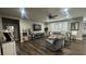 Inviting living room with a ceiling fan, hardwood floors, and comfortable seating at 716 Cadence View Way, Henderson, NV 89011