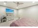 Bedroom featuring neutral walls, carpeted floors, ceiling fan, television, dresser and comfortable furnishings at 716 Cadence View Way, Henderson, NV 89011