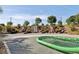 Outdoor playground featuring slides, terraces, and a green climbing structure at 716 Cadence View Way, Henderson, NV 89011