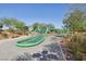 Outdoor playground showcasing a green climbing structure and rubberized safety surface at 716 Cadence View Way, Henderson, NV 89011
