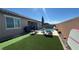 Backyard pool with lounge chairs and synthetic grass provides a relaxing outdoor oasis at 716 Cadence View Way, Henderson, NV 89011
