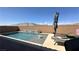 Backyard swimming pool with a serene waterfall feature and space for lounging at 716 Cadence View Way, Henderson, NV 89011