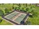 An aerial view highlighting well-maintained tennis courts within a community park, perfect for recreation at 716 Cadence View Way, Henderson, NV 89011