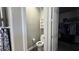 Toilet room showcasing a convenient layout with a toilet, shelving, and access to a walk-in closet at 716 Cadence View Way, Henderson, NV 89011