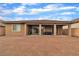 Large, gravel backyard shows covered patio area with ample space for outdoor furniture and gatherings at 741 Monroe Hill Pl, Henderson, NV 89011