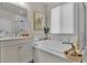 Relaxing bathroom featuring a soaking tub, single vanity, and soft natural light at 741 Monroe Hill Pl, Henderson, NV 89011