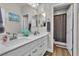 Modern bathroom with double vanity, quartz countertops, and a separate shower and toilet area at 741 Monroe Hill Pl, Henderson, NV 89011