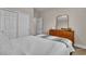 Comfortable bedroom featuring plush carpet, a full-size mirror and a stylish dresser at 741 Monroe Hill Pl, Henderson, NV 89011