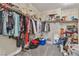 Walk-in closet filled with clothing, shoes, shelving and storage containers at 741 Monroe Hill Pl, Henderson, NV 89011