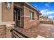 Welcoming front porch with brick accents and a paved walkway, adding curb appeal to the house at 741 Monroe Hill Pl, Henderson, NV 89011