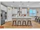 Bright kitchen featuring a large island, stainless steel appliances, pendant lighting, and a breakfast bar at 741 Monroe Hill Pl, Henderson, NV 89011