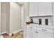 Mud Room with white cabinets and countertops, perfect for additional storage and organization near the front door at 741 Monroe Hill Pl, Henderson, NV 89011