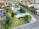 Wide aerial view showcasing a property with a pool, spacious grounds, and mature landscaping in a residential area at 7545 Constantinople Ave, Las Vegas, NV 89129