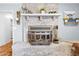 Close-up of a unique fireplace with white brick and decor at 7545 Constantinople Ave, Las Vegas, NV 89129