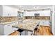 Bright, updated kitchen with granite countertops, an island, and stainless steel appliances at 7545 Constantinople Ave, Las Vegas, NV 89129