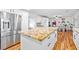 Spacious kitchen featuring a large center island with breakfast bar and stainless steel refrigerator at 7545 Constantinople Ave, Las Vegas, NV 89129