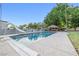 In-ground pool with slide, diving board, and tiki hut at 7545 Constantinople Ave, Las Vegas, NV 89129