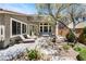 Backyard patio with lounge chairs, outdoor seating, and lush landscaping at 7567 Desertscape Ave, Las Vegas, NV 89178