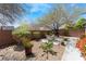 Serene backyard featuring a patio area, landscaping, and privacy wall at 7567 Desertscape Ave, Las Vegas, NV 89178