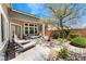 Backyard patio featuring lounge furniture, garden, and mature landscaping at 7567 Desertscape Ave, Las Vegas, NV 89178