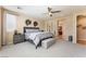 Spacious bedroom featuring a ceiling fan, with en-suite bathroom access at 7567 Desertscape Ave, Las Vegas, NV 89178