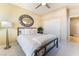 Bright bedroom with a ceiling fan, neutral paint and carpet, and a closet at 7567 Desertscape Ave, Las Vegas, NV 89178