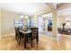 Elegant dining room with modern lighting fixtures and hardwood floors, perfect for entertaining guests at 7567 Desertscape Ave, Las Vegas, NV 89178