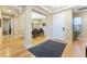 Open foyer features hardwood floors, a dining room, and a modern chandelier at 7567 Desertscape Ave, Las Vegas, NV 89178
