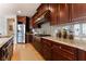Well-appointed kitchen featuring stainless steel appliances, granite countertops, and ample cabinet space at 7567 Desertscape Ave, Las Vegas, NV 89178