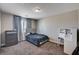 Bedroom with a bed, side table, dresser, and a desk near the window at 7572 Mount Spokane Ct, Las Vegas, NV 89113