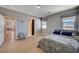 Cozy bedroom featuring hardwood floors, natural light, and neutral decor at 7572 Mount Spokane Ct, Las Vegas, NV 89113
