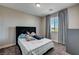 Bedroom featuring a bed, window with curtains, and carpeted flooring at 7572 Mount Spokane Ct, Las Vegas, NV 89113