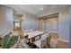 Open-concept dining area adjacent to living space with modern furniture at 7572 Mount Spokane Ct, Las Vegas, NV 89113